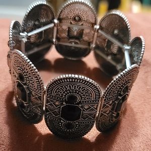 SILVER CUFF-LIKE BRACELET W/ BLACK STONE- 8 PANELS AROUND